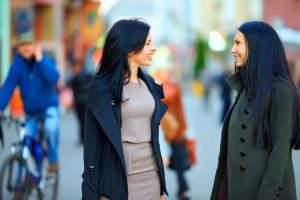 two happy women talking