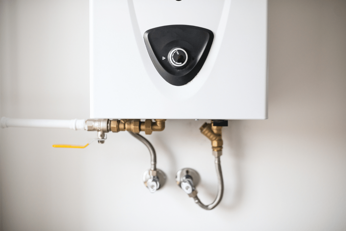 Tankless water heater on white wall