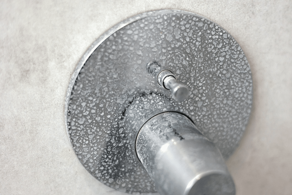 Hard water stains on shower faucet